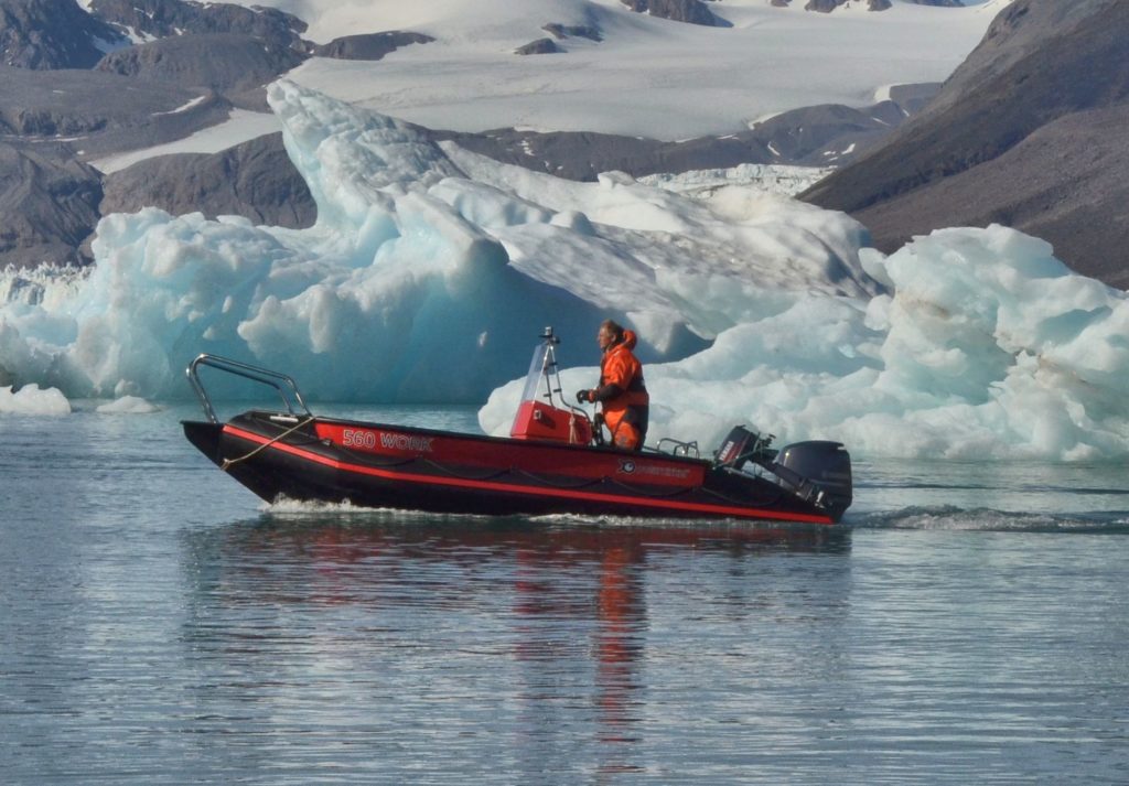 Station manager in workboat in Kongsfjorden