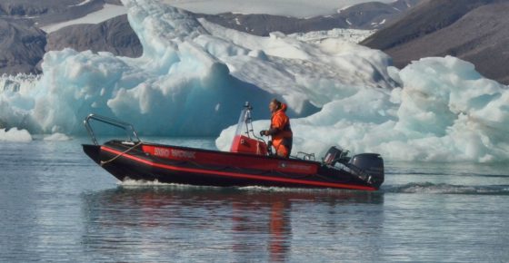 Station manager in workboat in Kongsfjorden